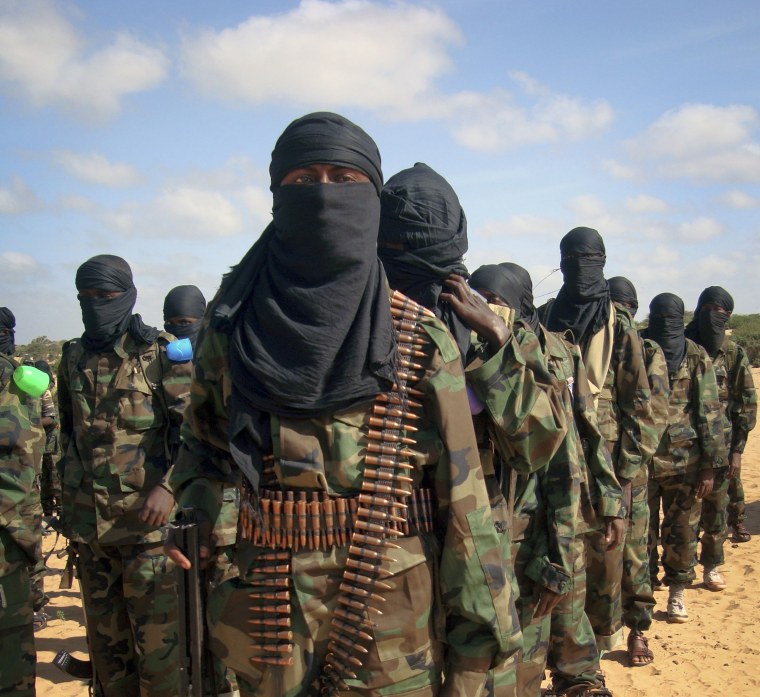 Image: Armed members of the militant group al-Shabab attend a rally on the outskirts of Mogadishu