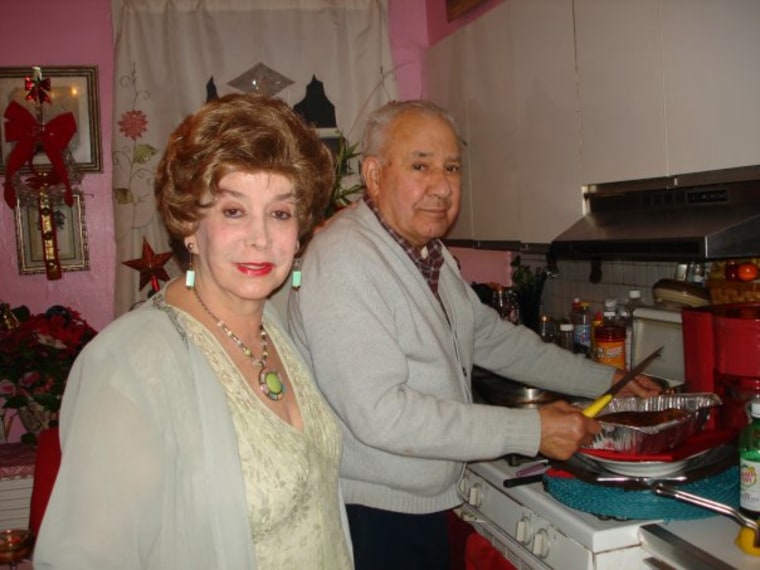 The author’s parents, Magaly Pacheco-Cusido and Armando Cusido, prepare pernil for Noche Buena in 2009.