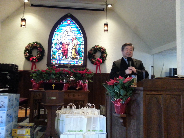 Rev. Sunggook Ahn at Neung Lyuk Church's Christmas church service, December 22, 2013.
