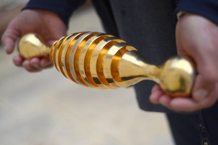 This mysterious, shiny, gold object was found on the grounds of a Jerusalem cemetery. 