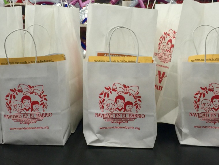 A row of goody bags at "Navidad en el Barrio" in Houston, TX, December 2015.