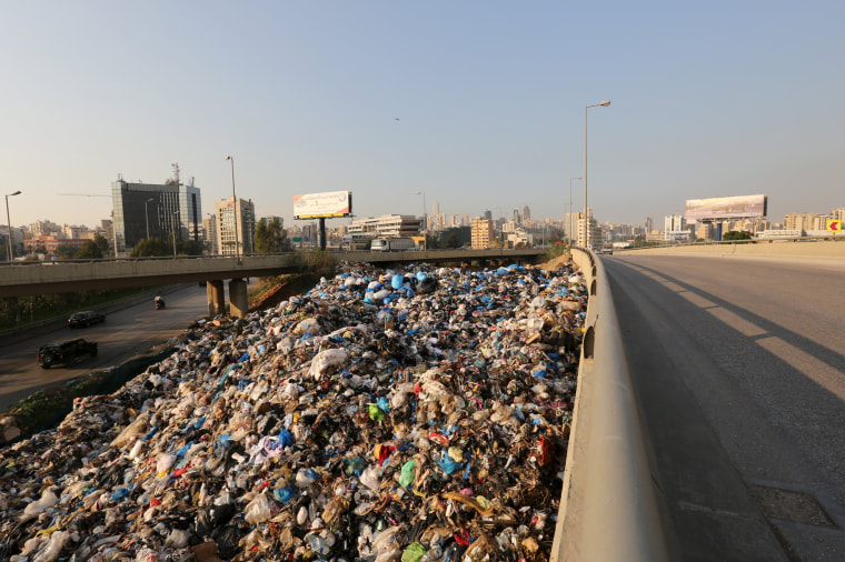 Image: A general view shows a garbage-filled area in Beirut