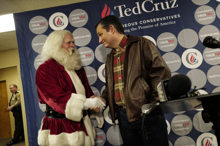 Republican presidential candidate Senator Ted Cruz holds a press availability at the Life Church on December 18, 2015 in Mechanicsville, Virginia. He was joined by a local man named Robin Hood (63) dressed at Santa Claus. (Photos by Charles Ommanney/The Washington Post via Getty Images)