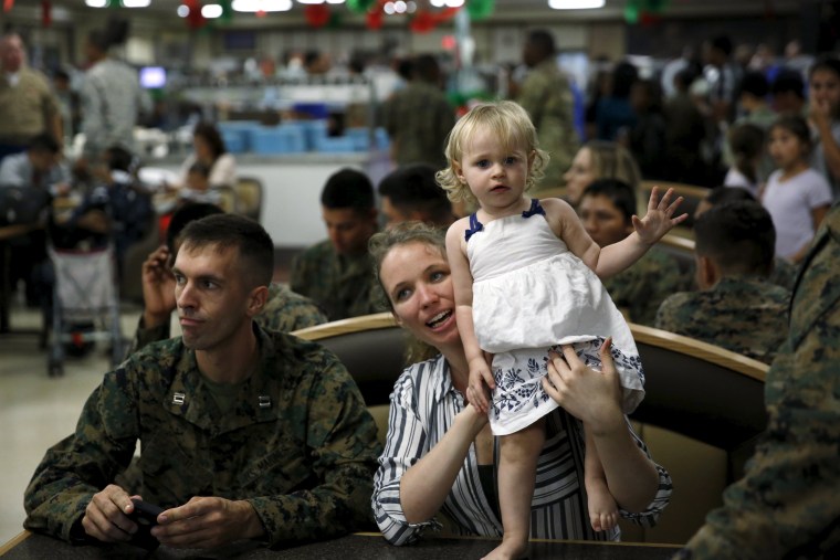 Image: Military families gather for a Christmas reception with Obama at Marine Corps Base Hawaii in Kaneohe Bay, Hawaii