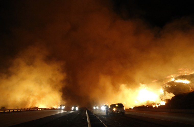 Image: PCH 1 north and south bound lanes are shutdown from the Solimar  brush fire that started early Saturday morning in Ventura County