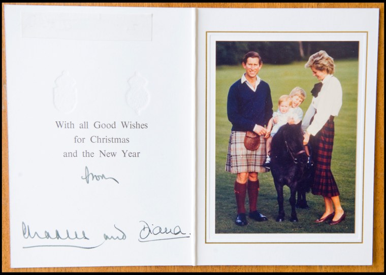 BNPS.co.uk (01202 558833)
Pic: Phil Yeomans/BNPS
Happy couple with William and Harry- Xmas 1985.
A poignant collection of Royal Xmas cards sent to a member of staff and signed by Charles and Diana is coming up for auction.
The cards show the Xmas portraits from the earliest days of the marriage in 1982 and catologue the birth of William and Harry in the following years.
The happy smiling cards give no hint to the bitterness and tragedy that would engulf the couple in later years.