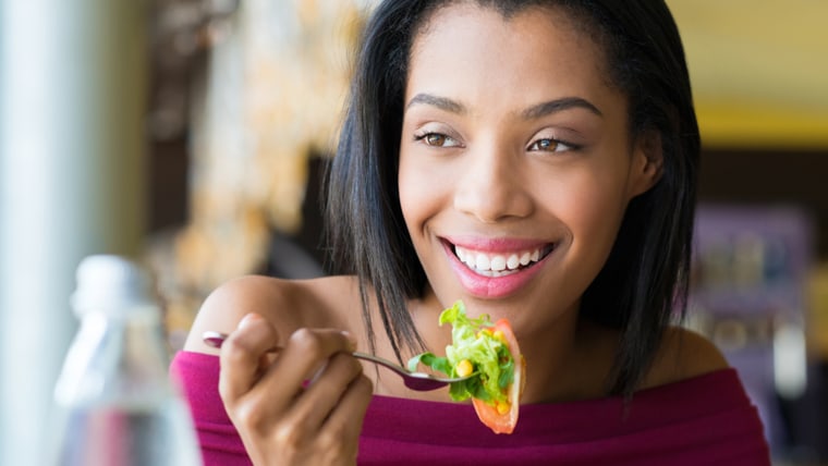 Woman eating with fork