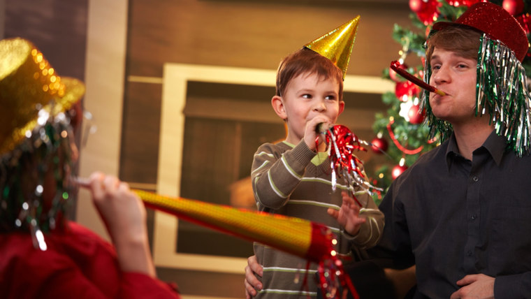 Parent and child celebrating New Year's Eve together