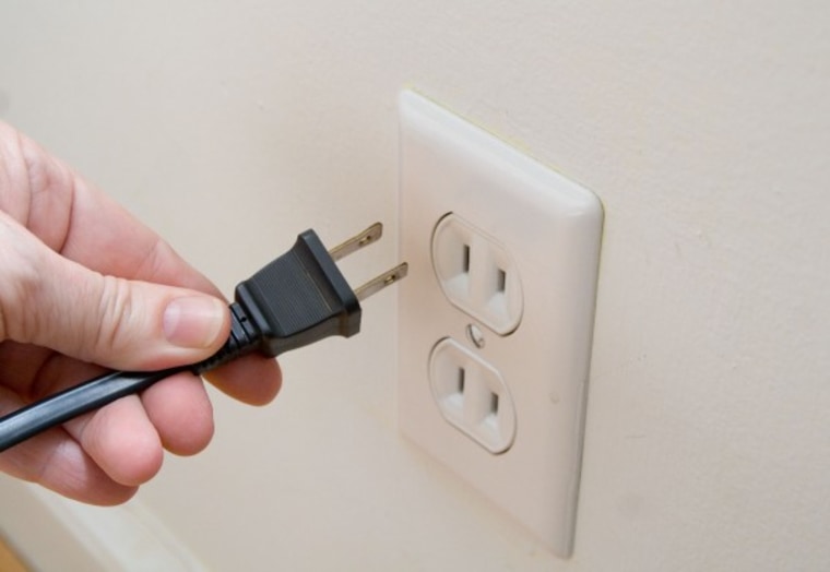 Cord being unplugged from wall.