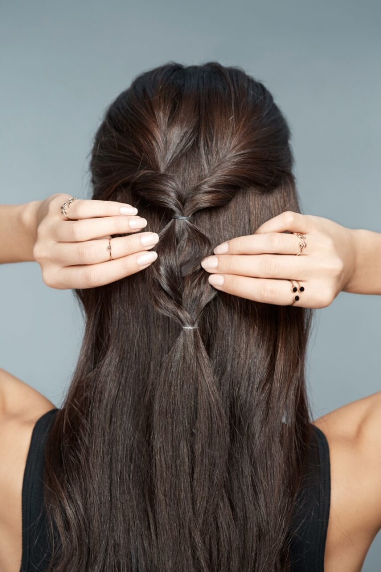4) Braid the hair about 2-3 inches down and secure with another ponytail holder. Grab either end of the braid and pull apart to make it looser.