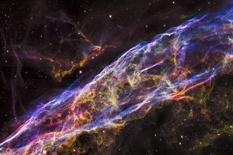 Image: A small section of the expanding remains of the Veil Nebula is seen in an image from NASA's Hubble Space Telescope