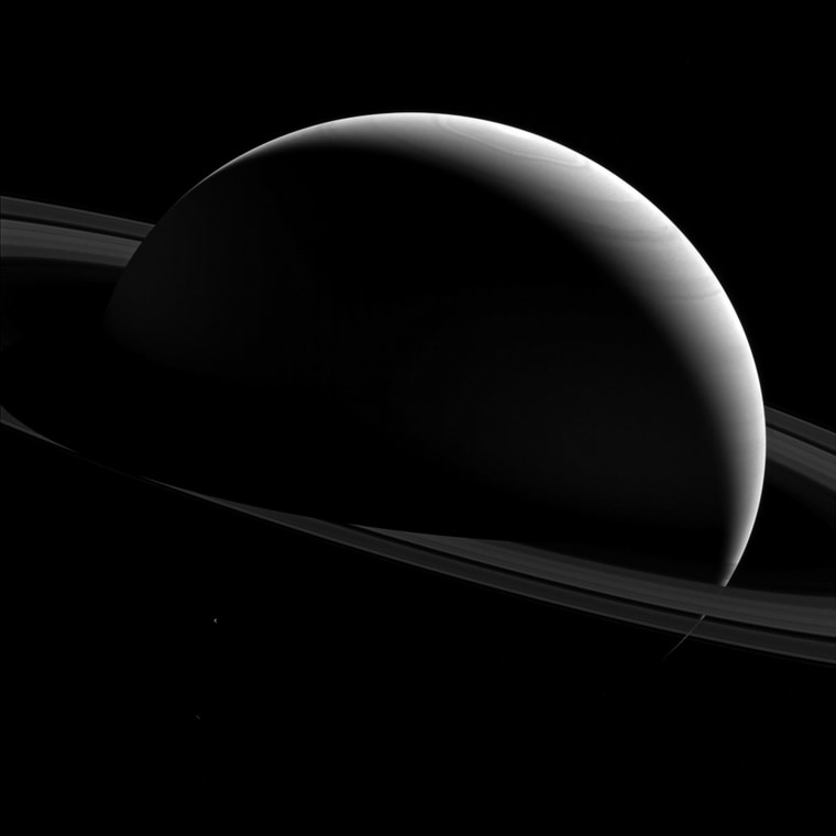 Image: Saturn and moon Tethys seen in a NASA handout image