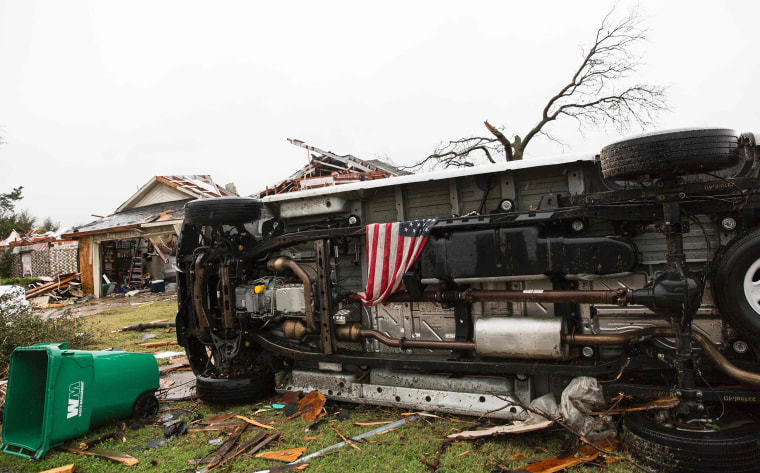 Image: An American flag placed by first responders is seen in the aftermath of a tornado in Rowlett, Texas.