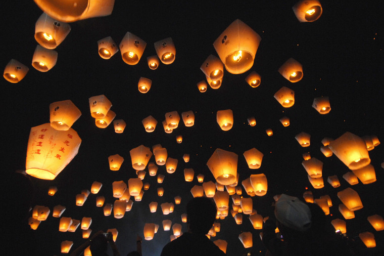 Image: People release sky lanterns in Pinghsi,