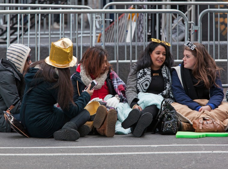 Revelers wait in New York's Times Square on Thursday morning, well ahead of New Year's celebrations. One million people are expected in Times Square to ring in the new year.
