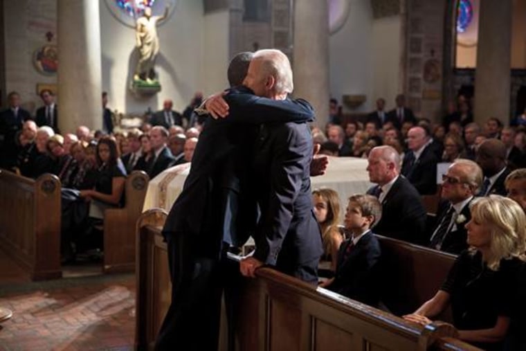 President Obama and Vice President Joe Biden embrace at the funeral of Beau Biden.