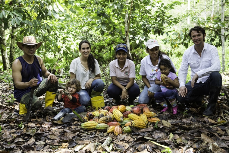 Santiago Peralta and his wife Carla Barboto, founder of the chocolate maker Pacari, with cacao farmers in Ecuador.