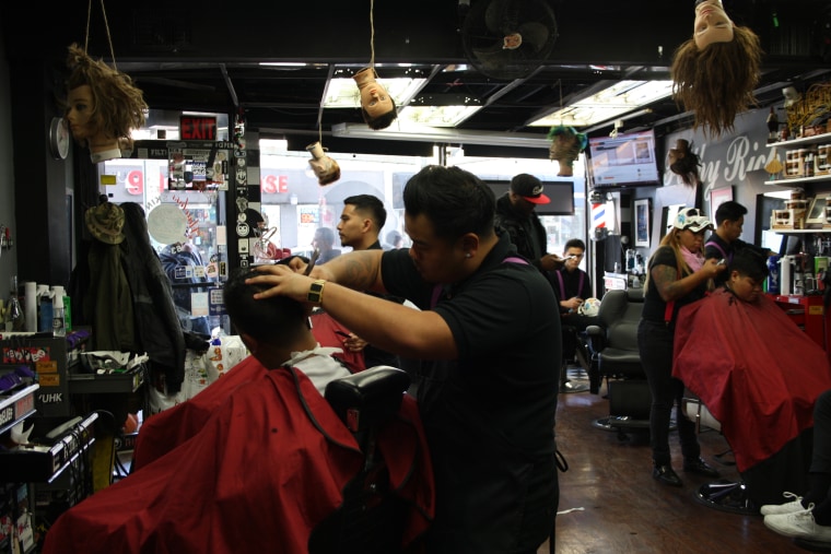 The interior of the Filthy Rich Barbershop in the Woodside neighborhood of Queens, New York.
