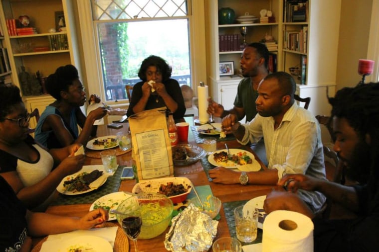 Members of the Rhode Island Writers Colony share a meal.