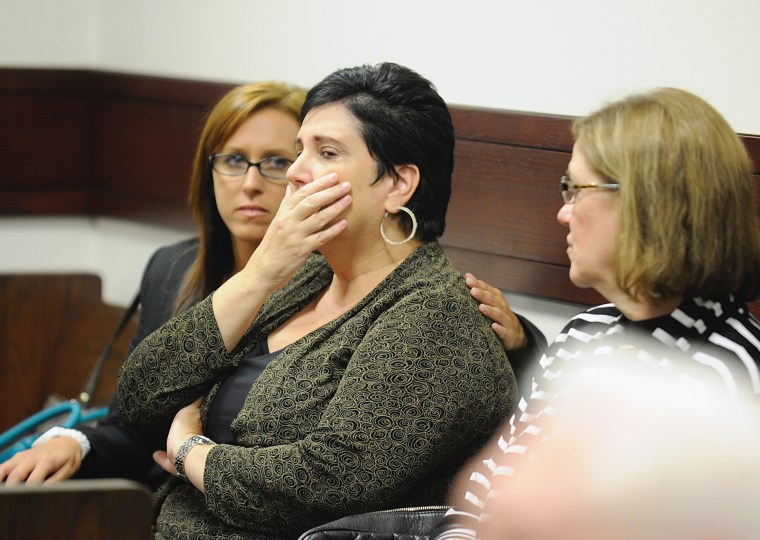 Rosalie Bolin, the wife of Oscar Ray Bolin Jr. is consoled by Dawn Hart, left, as Martha Mortenson, right, looks on after Oscar Ray Bolin Jr. was found guilty in the killing of Natalie Blanche Holley Thursday, April 19, 2012, in Tampa.
