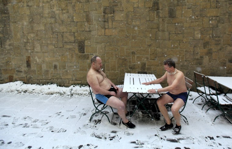 Image: Participants prepare for the traditional Three Kings swim to commemorate Epiphany at the Vltava River in Prague