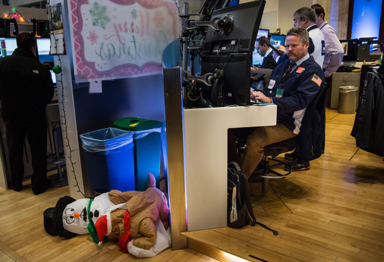 Image: A trader works on the floor of the New York Stock Exchange