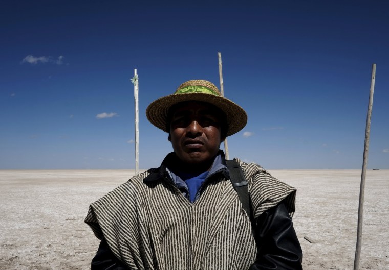 Image: Fisherman Rene Valero, from the Urus ethnic group, is seen at the dried Poopo lakebed in the Oruro Department, south of La Paz, Bolivia