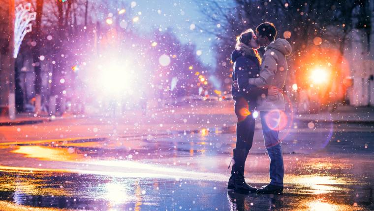 In love couple kissing in the snow at night city street. Filtered with grain and light flashing; Shutterstock ID 267543896; PO: today.com