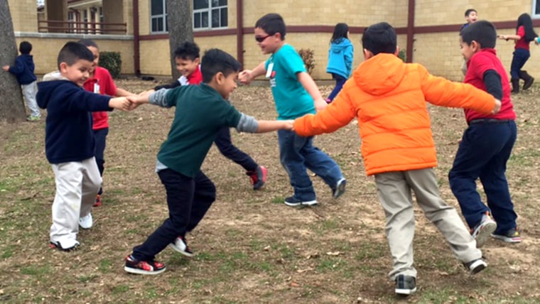 students outside school playing