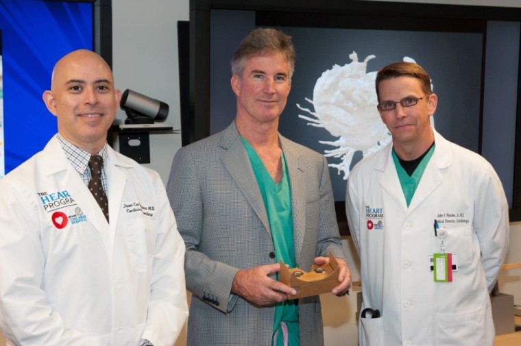 Dr. Juan Carlos Muniz (left), Dr. Redmond Burke (center, holding Google Cardboard) and Dr. John Rhodes, all of Nicklaus Children's Hospital, collaborated on planning Teegan's surgery.