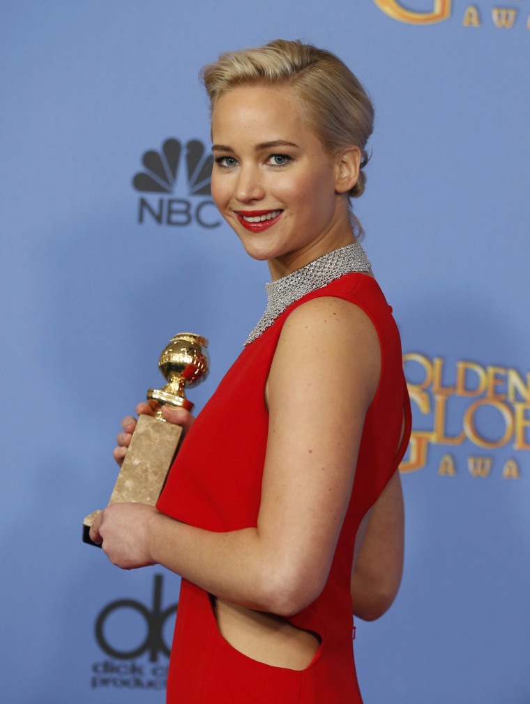 Image: Jennifer Lawrence poses backstage with the award for Best Performance by an Actress in a Motion Picture - Musical or Comedy for her role in "Joy" at the 73rd Golden Globe Awards in Beverly Hills