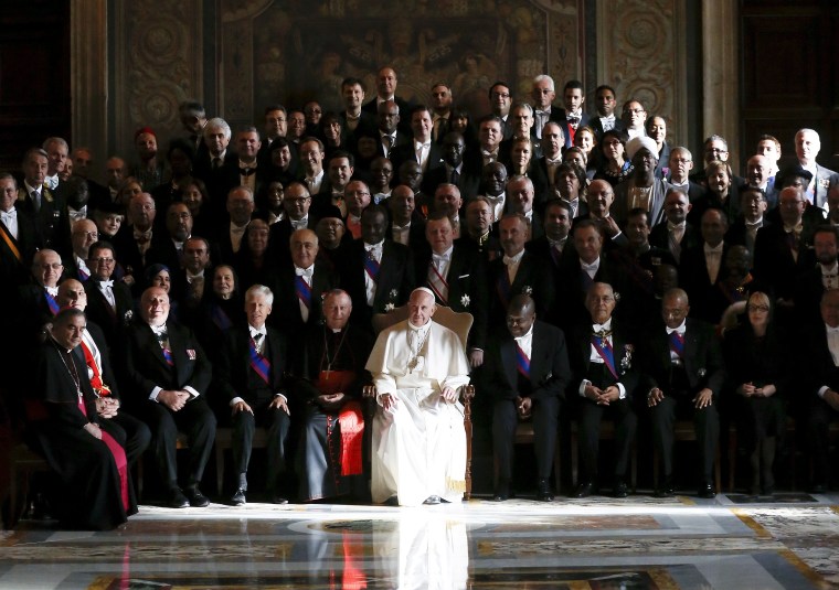 Image: Pope Francis poses with ambassadors during an audience with the diplomatic corps at the Vatican