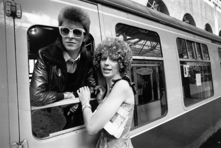 Image: Bowie is seen off at a station by his wife Angie on July 9, 1973.