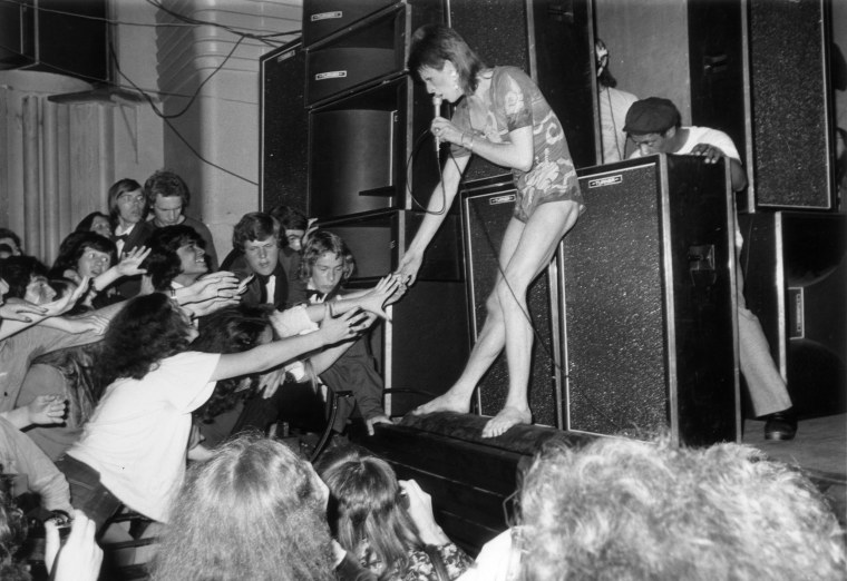 Image: Adoring fans reach out to touch the hand of Bowie in July 1973
