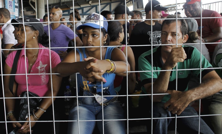 Image: Cubans migrants await to receive humanitarian visas at a border post with Panama in Paso Canoas