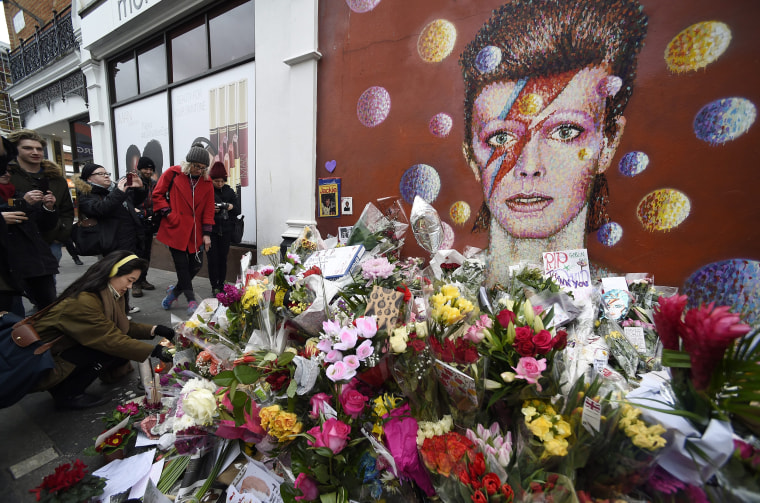 Image: Well-wishers flock to Bowie mural in Brixton following the singer's death
