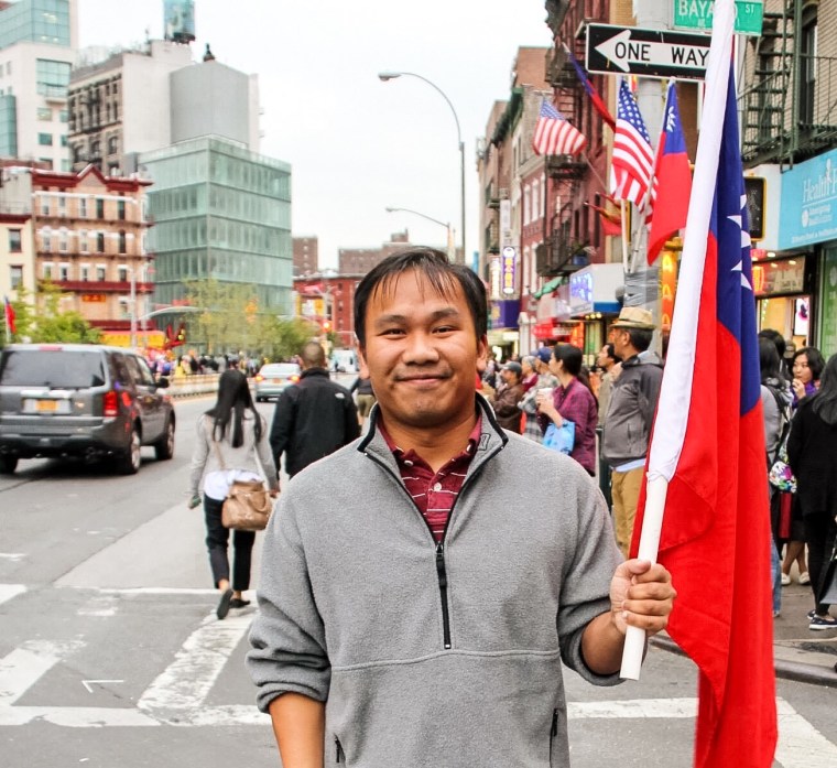 36-year-old David Kwang carrying a Taiwanese flag. Kwang, a former president of the Taiwanese Benevolent in New York, says he will be casting a vote for Nationalist candidate Eric Chu on Jan. 16.