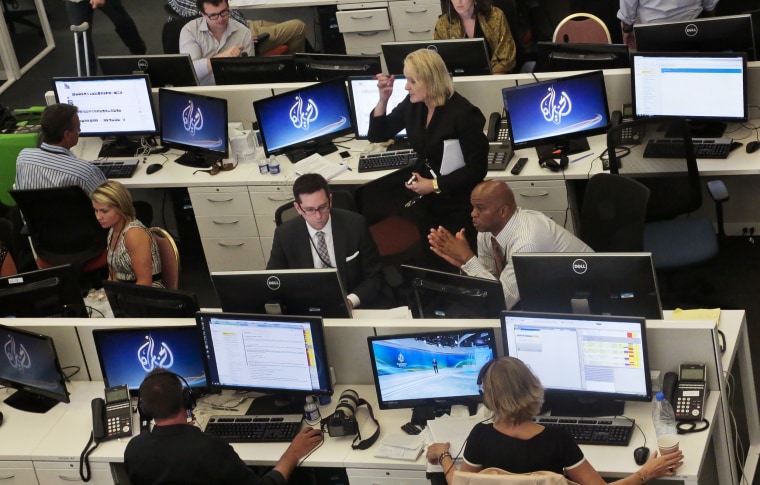 Image: Al-Jazeera America editorial newsroom staff prepare for their first broadcast in New York on Aug. 20, 2013.