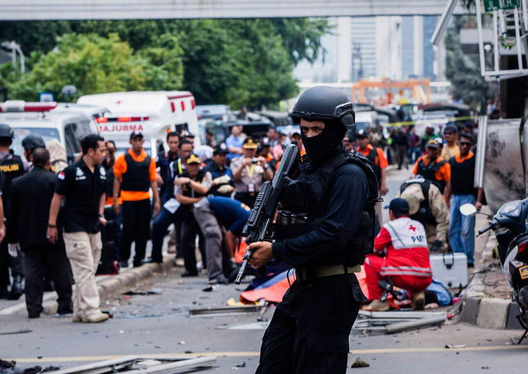 Image:A policeman stands guard in front of the blast site