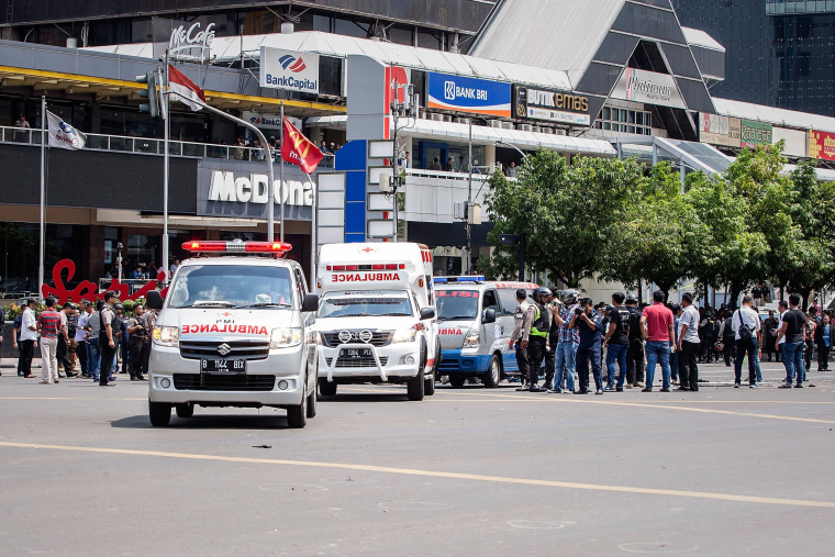 Image: Policemen and ambulance arrive in front of Sarinah shopping mall