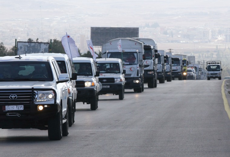 Image: A convoy of aid from the Syrian Arab Red Crescent leaves the capital Damascus