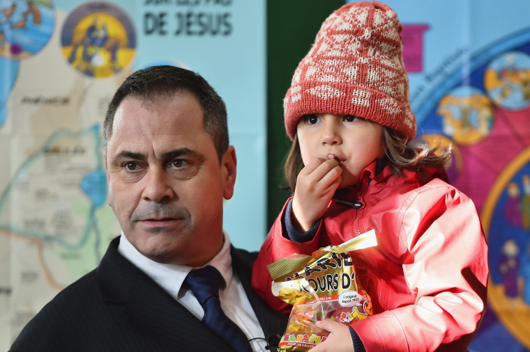 Image: Rob Lawrie arrives at a press conference with Bahar Ahmadi