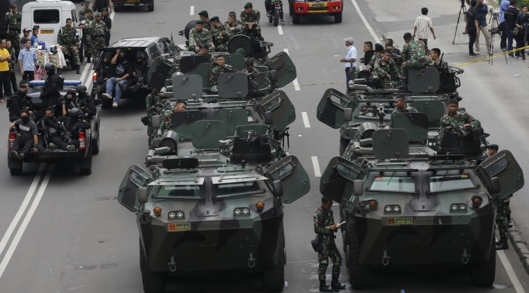 Image: Soldiers man armored vehicles near the site of the attacks in Jakarta, Indonesia Thursday.