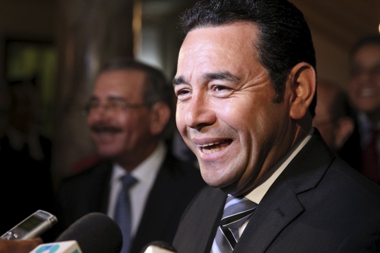 Image: Guatemala's President-elect Jimmy Morales talks with the media during his visit to the National Palace in Santo Domingo