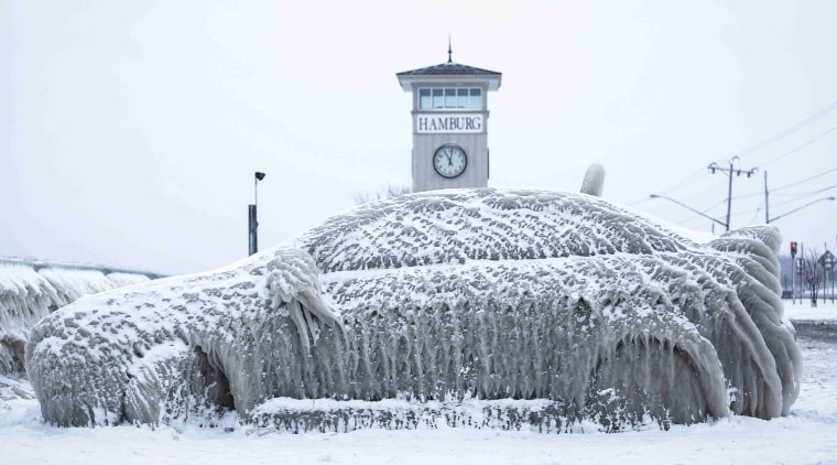 Image: A car covered with ice remains stranded on the waterfront in Hamburg, New York
