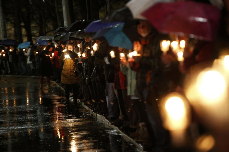 Image: Participants hold candles during a counter-protest against the anti-Islam movement Patriotic Europeans Against the Islamization of the West (PEGIDA), in Leipzig, Monday.