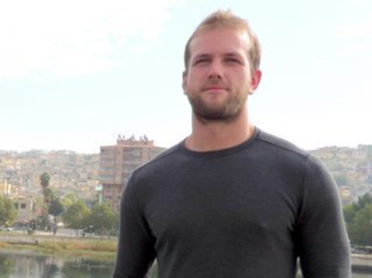 Matthew Trevithick stands near the Syrian border.