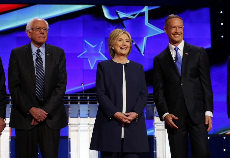 Image: Democratic presidential candidates Sanders, Clinton and Governor O'Malley stand together onstage before the start of the first official Democratic candidates debate of the 2016 presidential campaign in Las Vegas