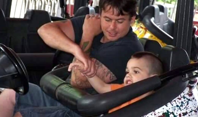 McGee and Logan, ride bumper cars together at a community festival.