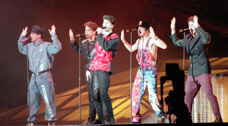 American teen pop group \"New Kids on the Block\" are performing their hit number \" Call It What You Want\" as they kick off a world tour at the Tokyo Dome, Japan, on January 31, 1991.  (AP Photo/Katsumi Kasahara)